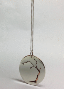 Sterling silver disc with arbutus cut out. Copper shows the lovely colour of the arbutus bark. Diameter is 3cm. $65