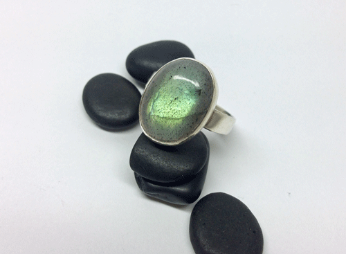 Labradorite stone set in sterling silver. The stone is 15 by 10 mm. Size 61/2. $65