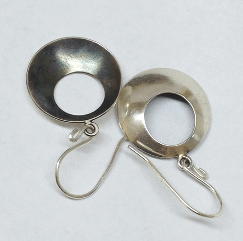 Domed and patinated earrings. Backs are finished to a mirror polish. $30