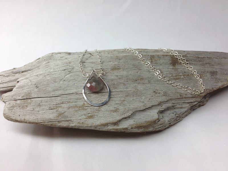 Pink and blue coloured tourmaline briolette suspended in 20mm drop shaped hoop. Sterling silver chain equivalent to 18" chain. $40