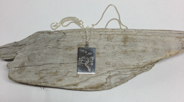 Inspired by a specific pine tree that hangs over the water at Lighthouse Park in West Vancouver. The pendant is 13mm x 20mm sterling silver. Comes on 18" sterling silver chain.