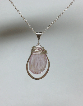 Kunzite briollette in drop shaped hoop. The hoop is ~30mm long. Comes with 18" chain. All silver is sterling. $60