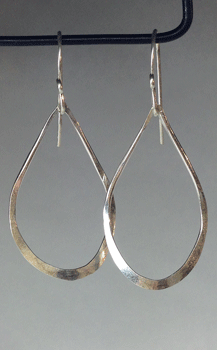 3cm long bent teardrop shaped hoops. All silver is sterling. $30