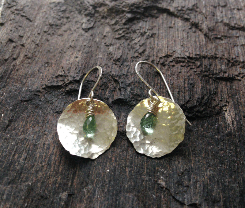 Hammered to reflect the colour of the tourmaline, these earrings play with light beautifully. Disks are ~20mm in diameter. $75
